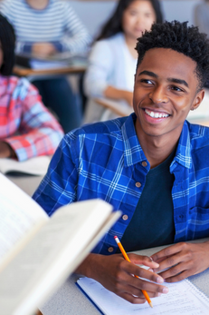 young man listening attentively to teacher